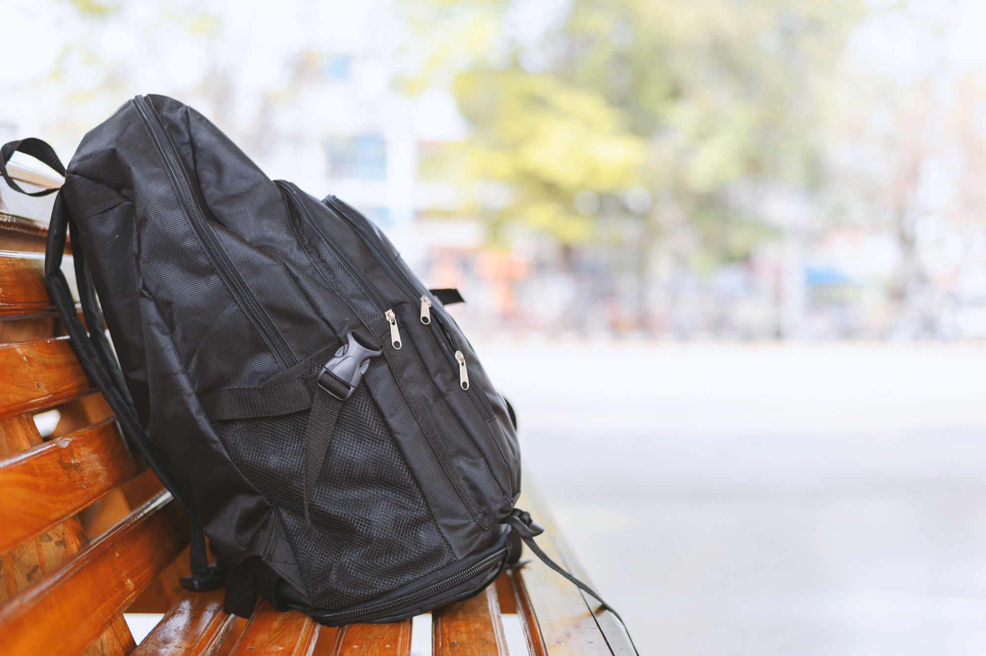 proper way to wear a backpack